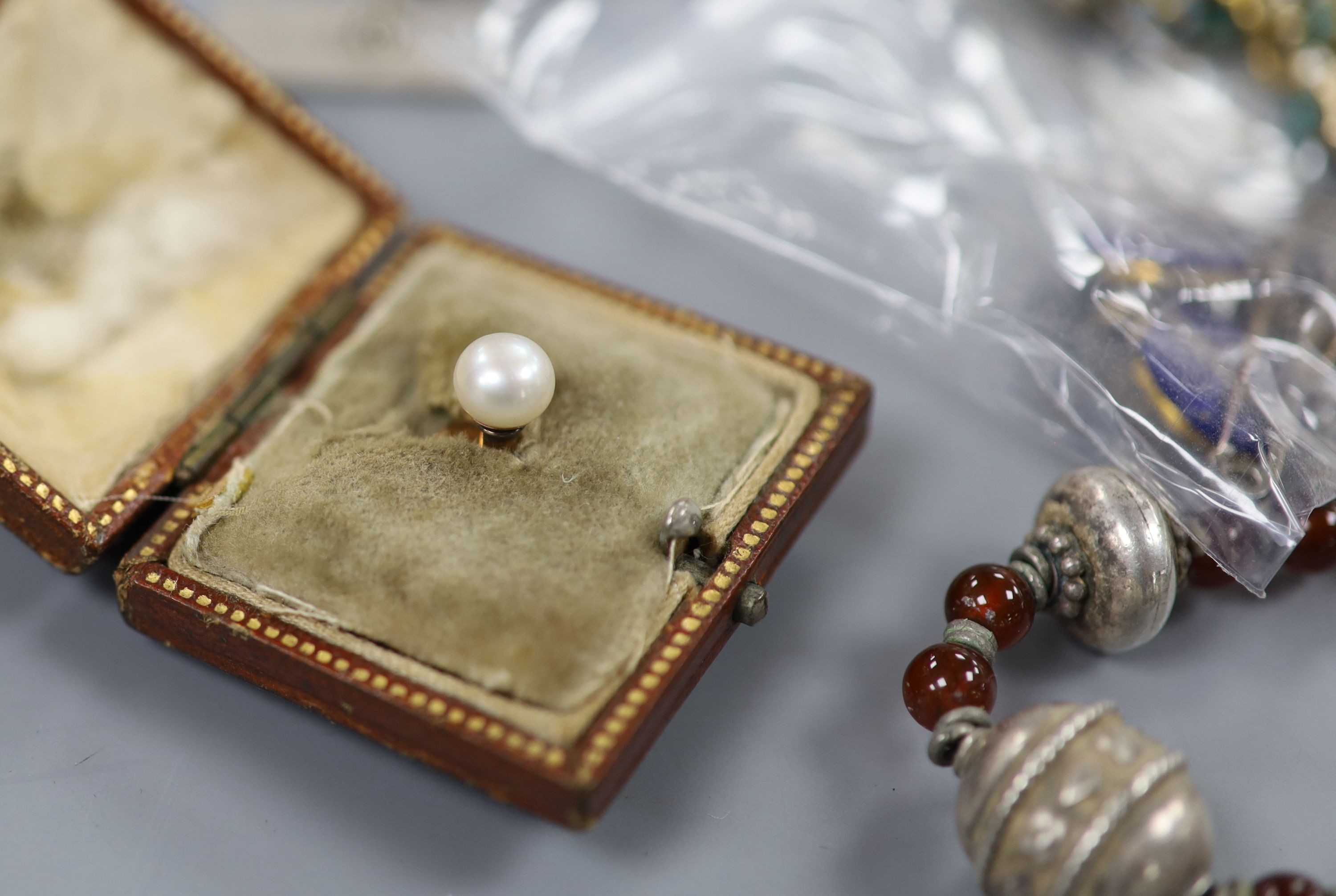 A mixed group of Victorian and later jewellery etc. including a white metal and diamond line pendant(a.f.), a lapis lazuli and diamond chip set cufflink, a small pair of two stone diamond earrings and a diamond set fox h